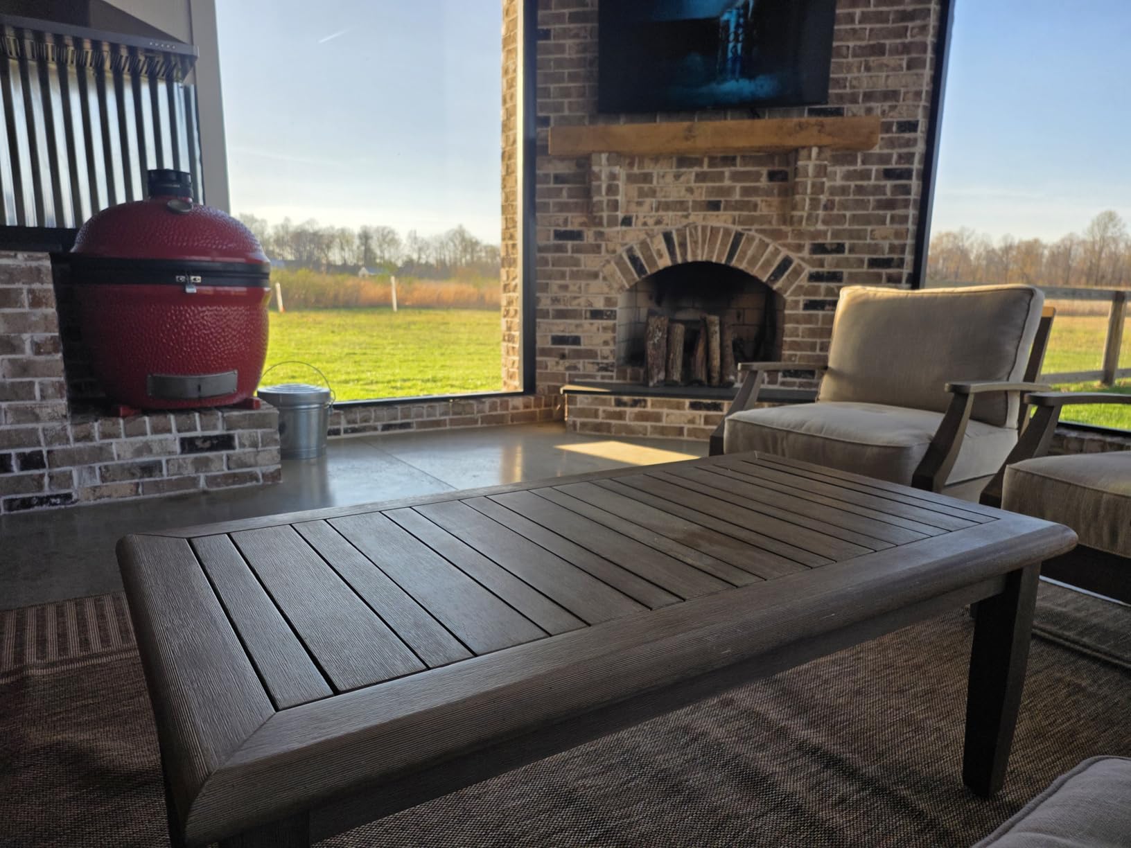 Signature Design by Ashley Gerianne Outdoor Coffee Table, Eucalyptus Wood Outdoor Table With 5-Step Protective Finish & Slatted Top for Rain Shedding, Durable Outdoor Patio Table, Brown customer photo 1