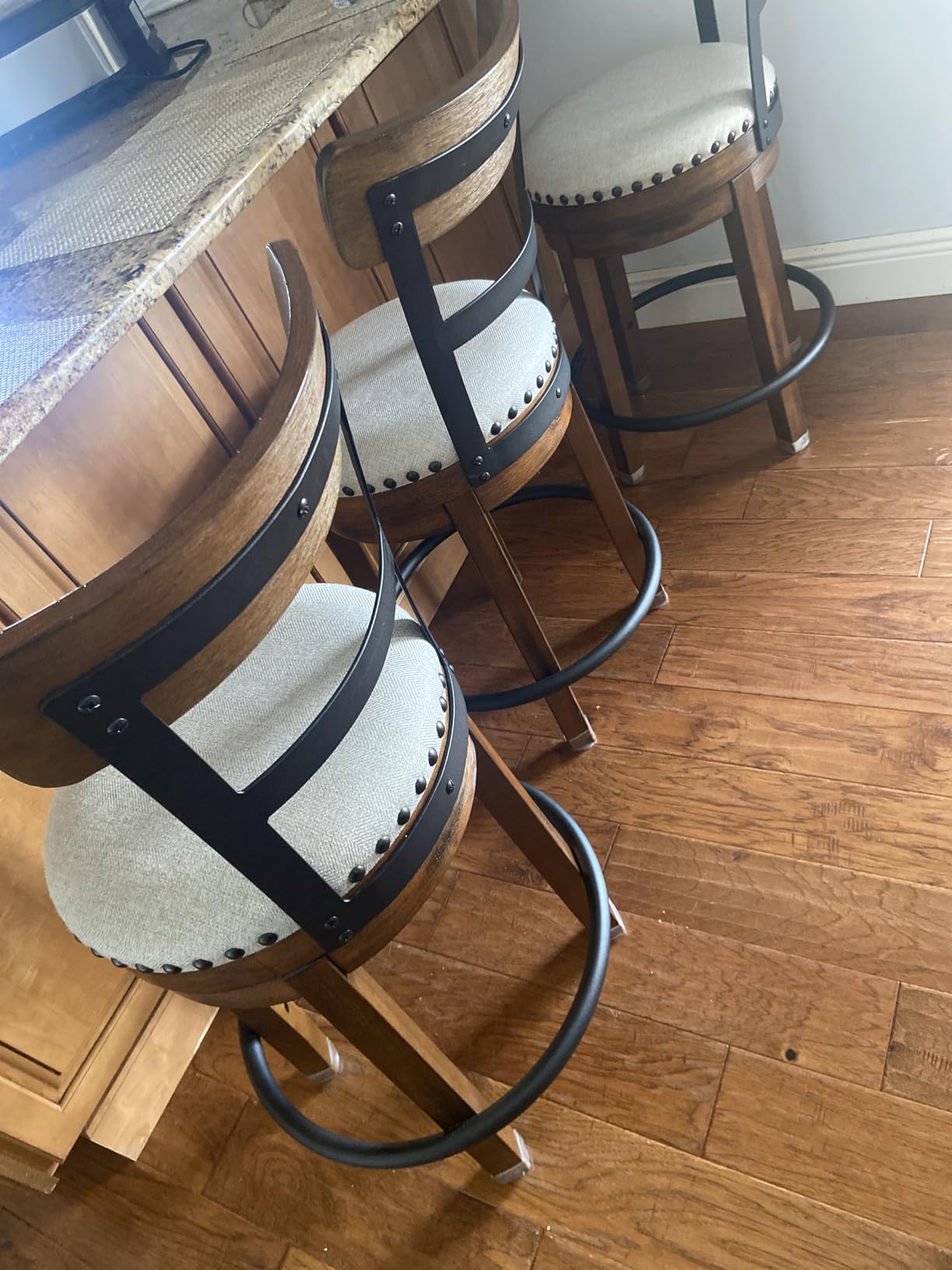 Signature Design by Ashley Valebeck Faux Leather Upholstered Swivel Barstool, Nailhead Trim, Solid Wood, 16.75