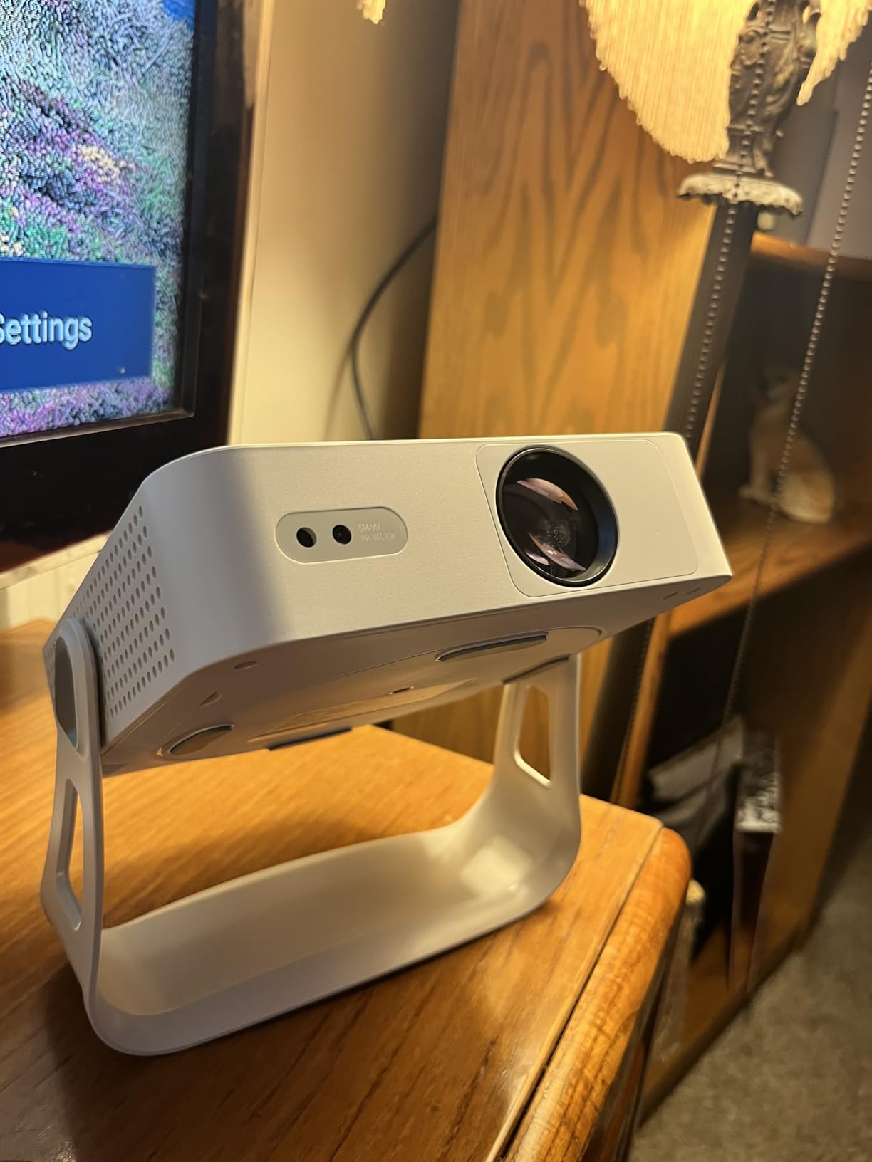 XuanPad Smart Mini Projector with WiFi and Bluetooth, 4K Support Movie Projector, Portable Native 1080P Outdoor Projector with 360 Degree Stand, Auto Focus customer photo 1