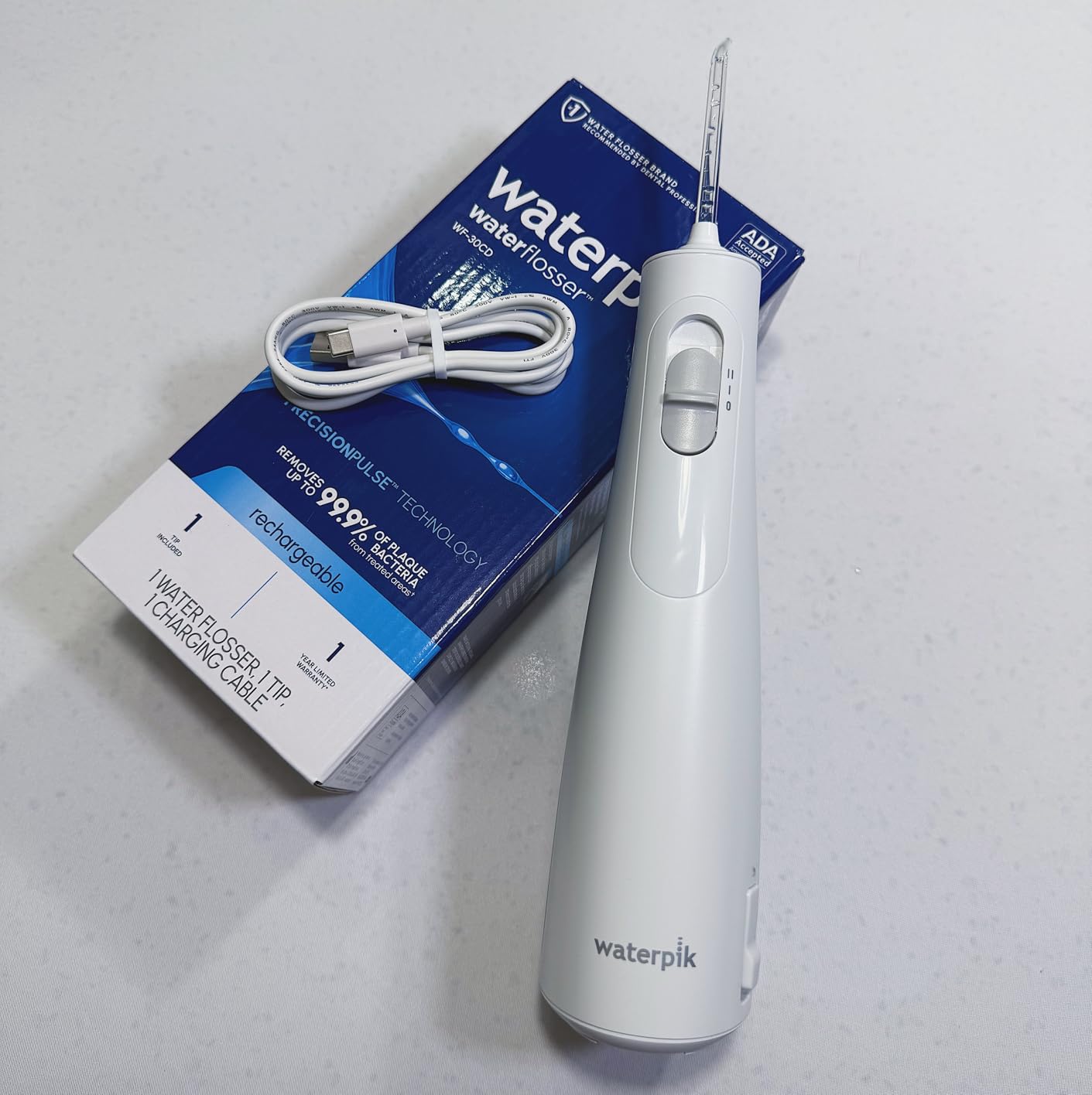 Waterpik Cordless 1100 Rechargeable Portable Water Flosser for Teeth Cleaning and Flossing, Travel, Braces Care, Healthier Gums, Waterproof for Shower, ADA Accepted, WF-30CD Black, Packaging May Vary customer photo 1