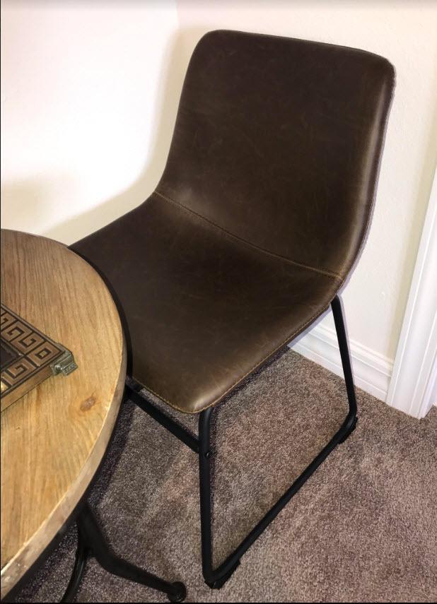 Signature Design by Ashley Centiar Mid-Century Dining Chair Set of 2, Brown | Contoured faux leather bucket seats, Matte black tubular metal base, Optimized for compact kitchen and eat-in spaces customer photo 2