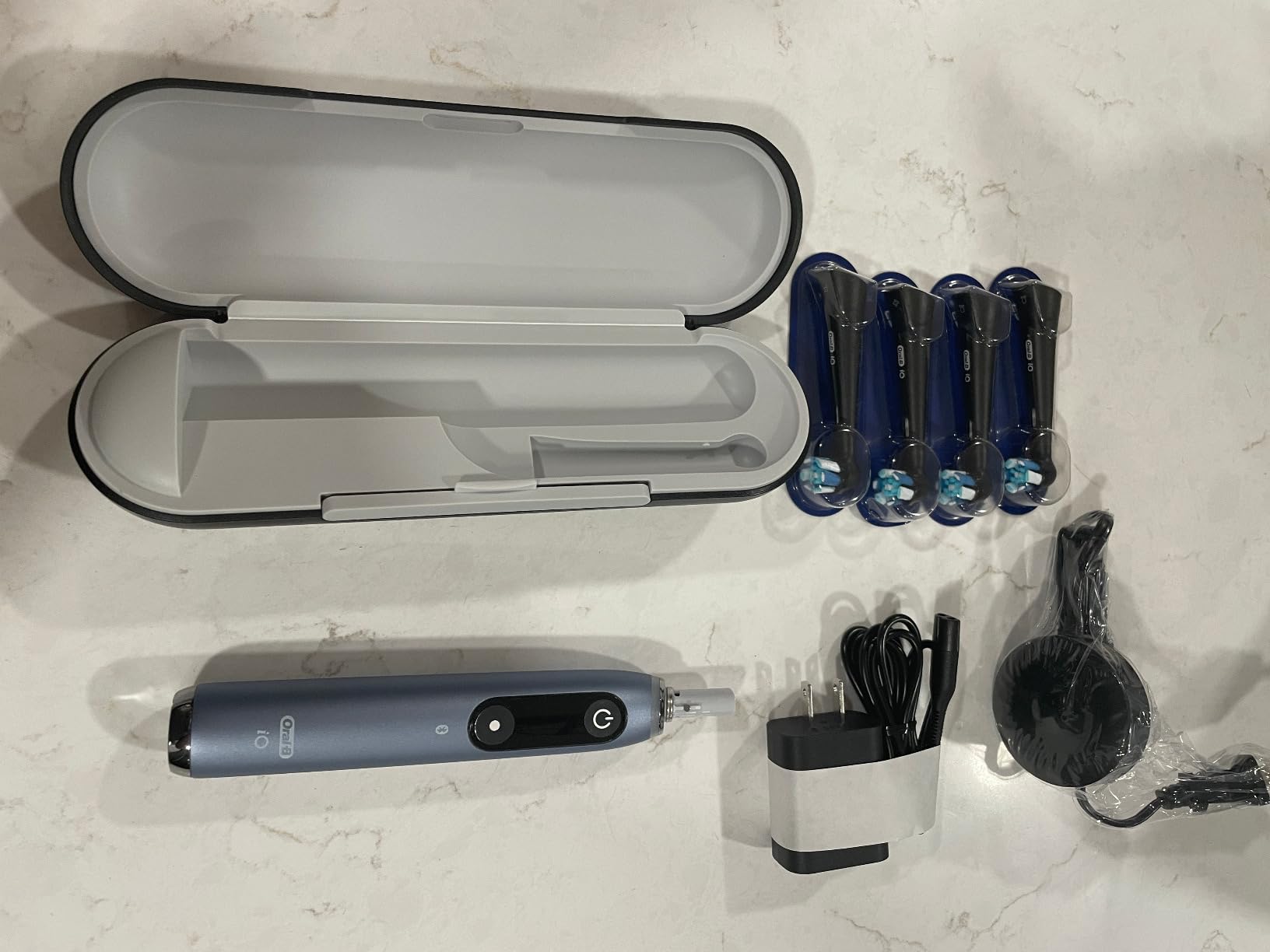 Oral-B iO Series 9 Genius Rechargeable Electric Toothbrush, Black, 4 Replacement Brush Heads, Power Charging Travel Case, Teeth Whitening, Visible Pressure Sensor to Protect Gums, 7 Modes customer photo 1