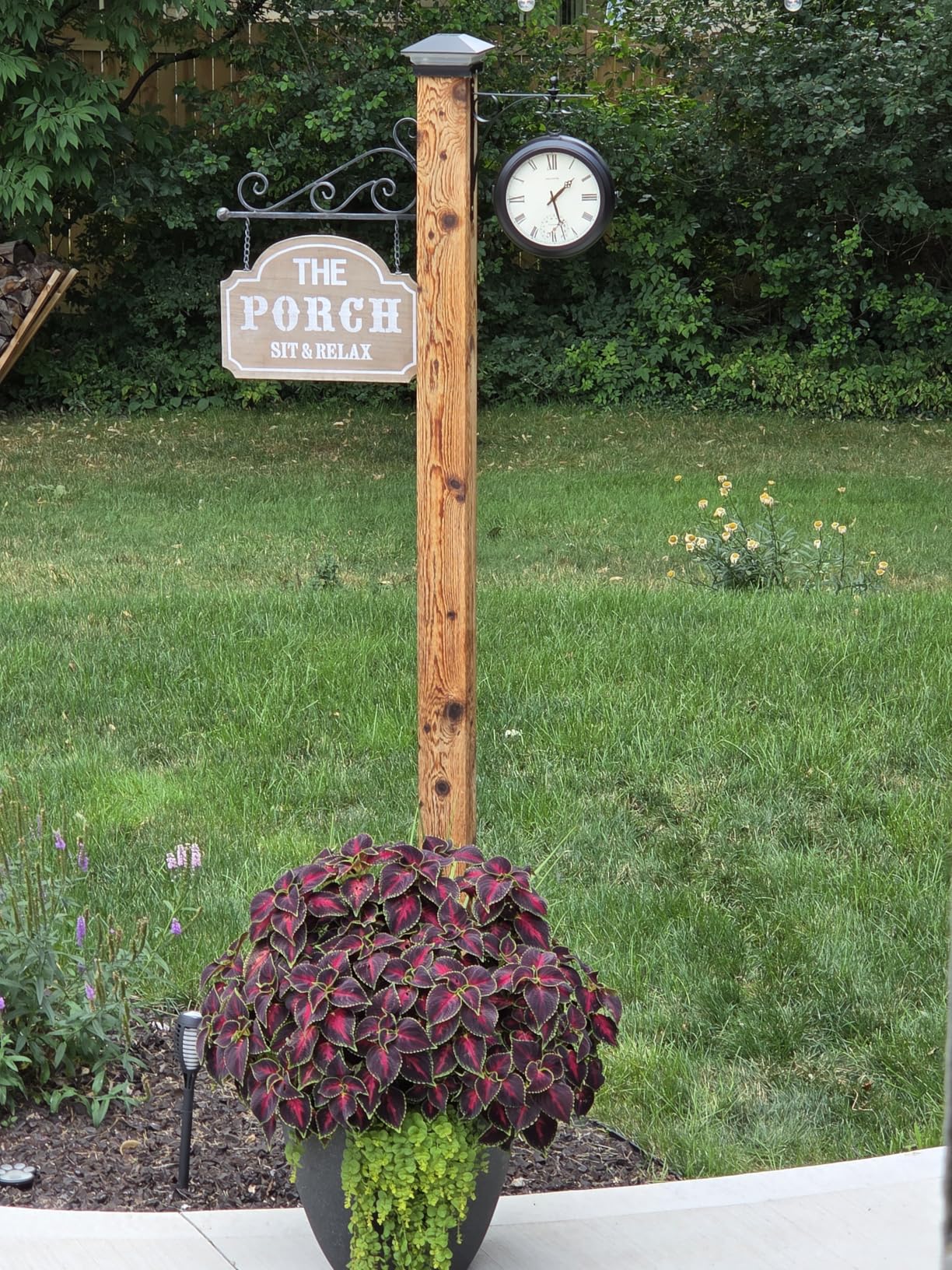 AcuRite 9-Inch Indoor/Outdoor Double-Sided Hanging Clock with 360-Degree Spin Functionality, Iron Metal Frame, Glass Lens, Quartz Crystal Movement, Weatherproof and Premium Thermometer (75140M), Black customer photo 1