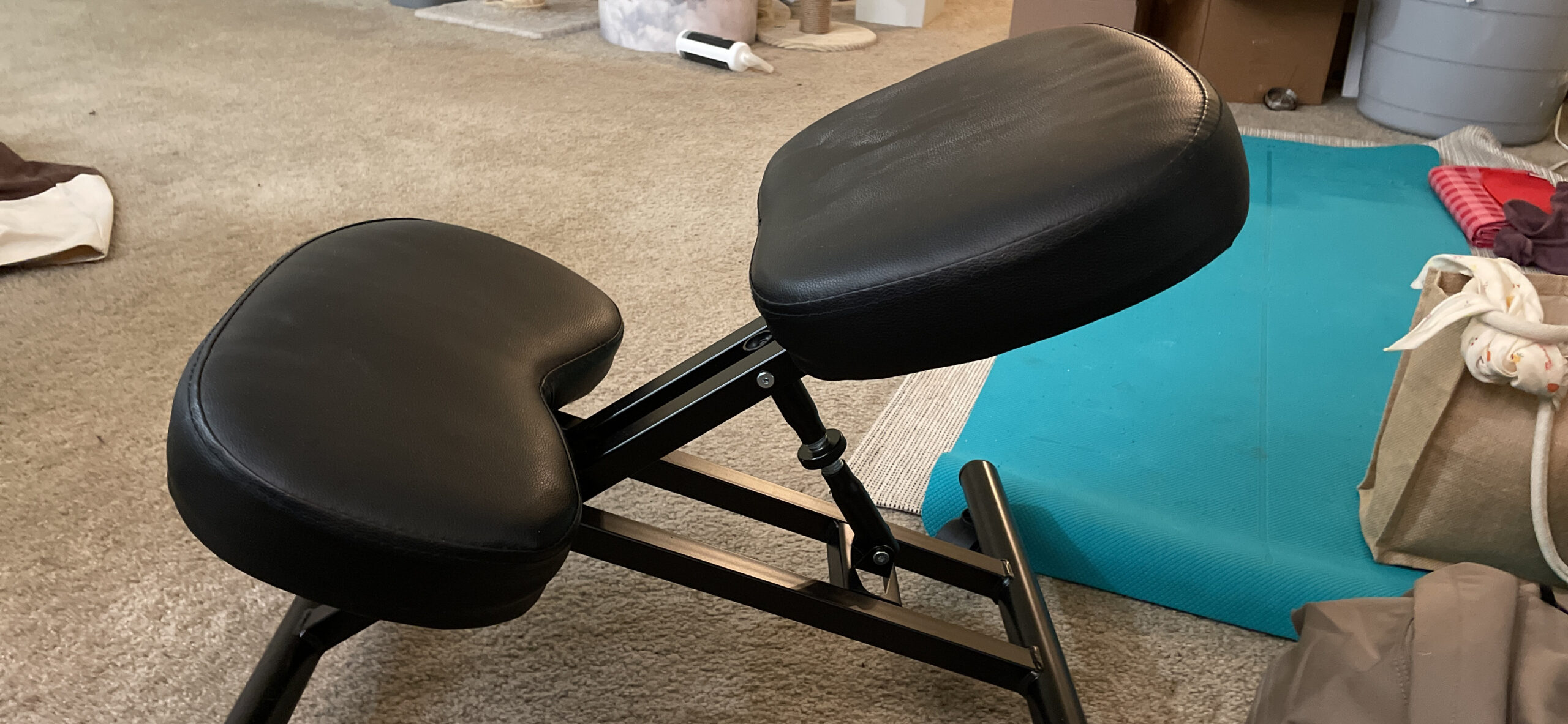 Yaheetech Ergonomic Kneeling Chair, Adjustable Rolling Knee Stool, Black | Thick foam cushions in faux leather support an upright posture; the metal frame tilts 91-130 degrees and rolls on casters. customer photo 2