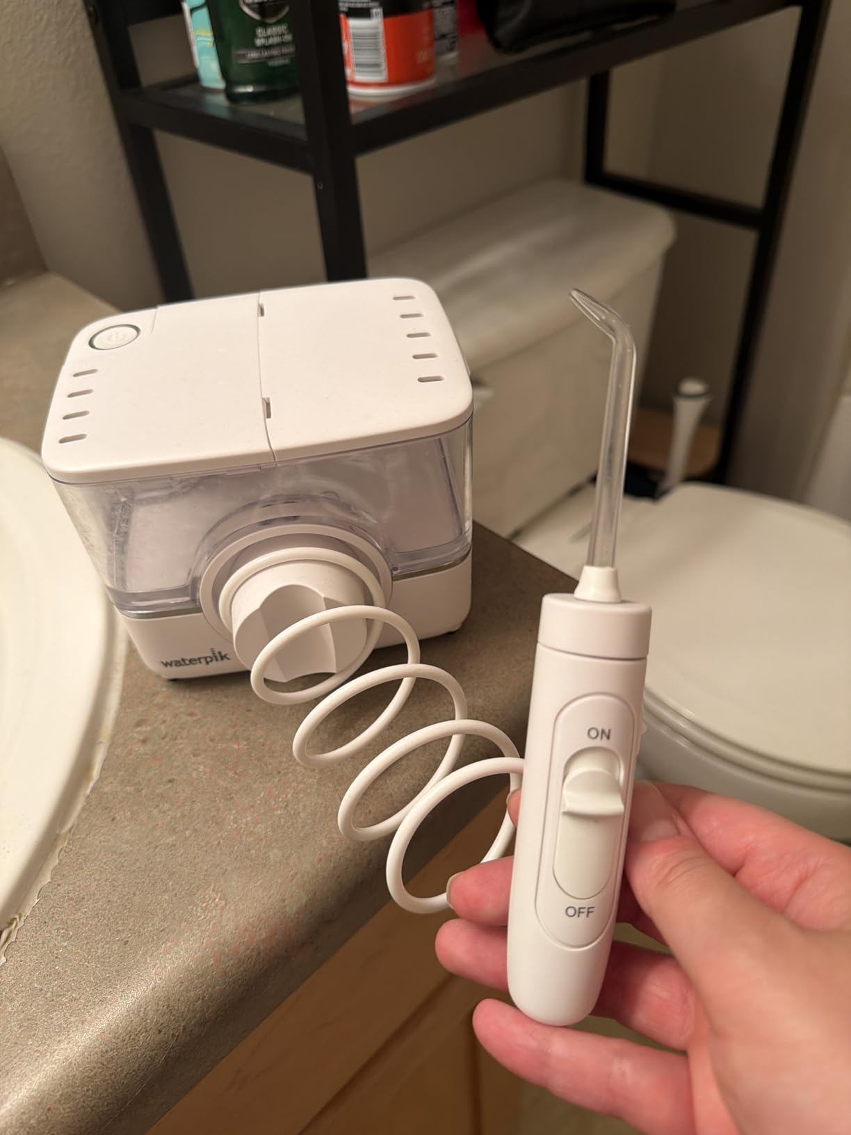 Waterpik ION Rechargeable Water Flosser with 10 Settings, 7 Tips, Black | Portable Cordless Countertop for at Home Daily Gum Health, Dental Braces, Implants, ADA Accepted, WF-12 Packaging May Vary customer photo 1
