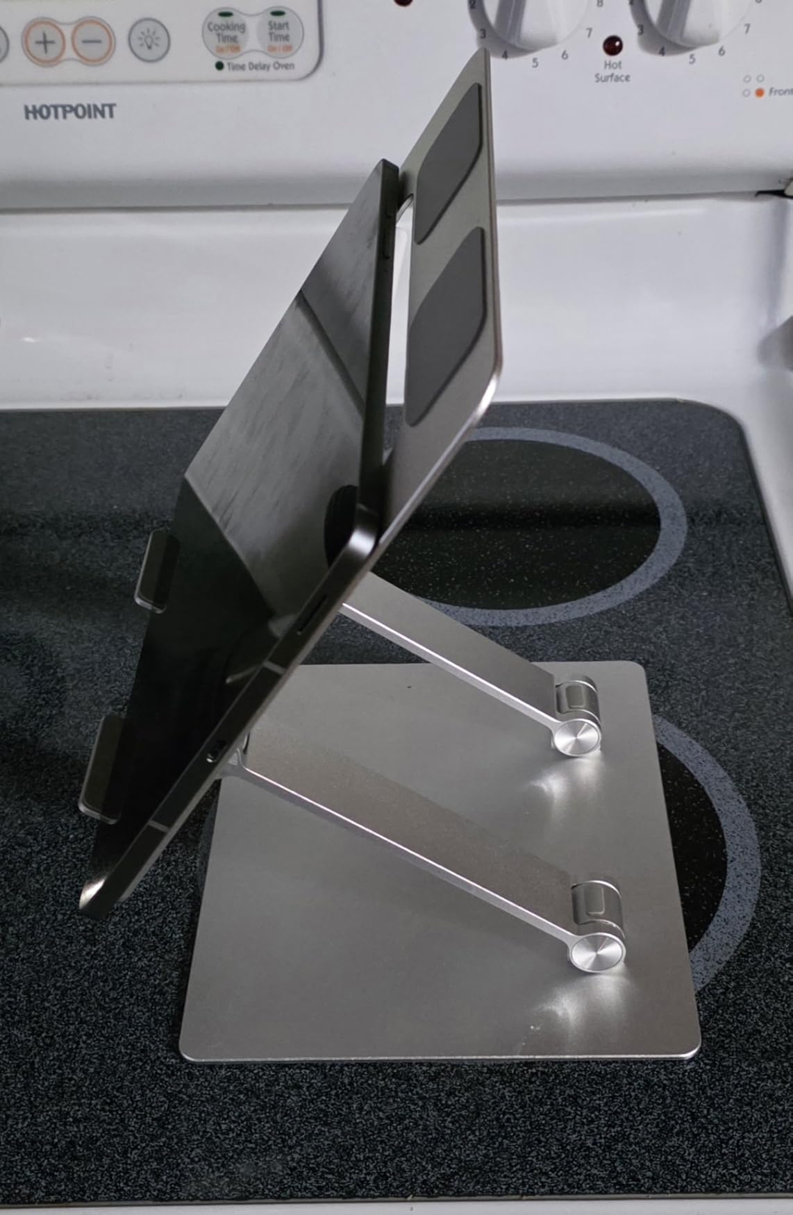Amazon Basics Sturdy and Portable Ergonomic Laptop Stand for Desk, Height Adjustable Riser with Ventilated Cooling, Foldable, Fits all Laptops up to 15.6 Inch, Silver customer photo 2