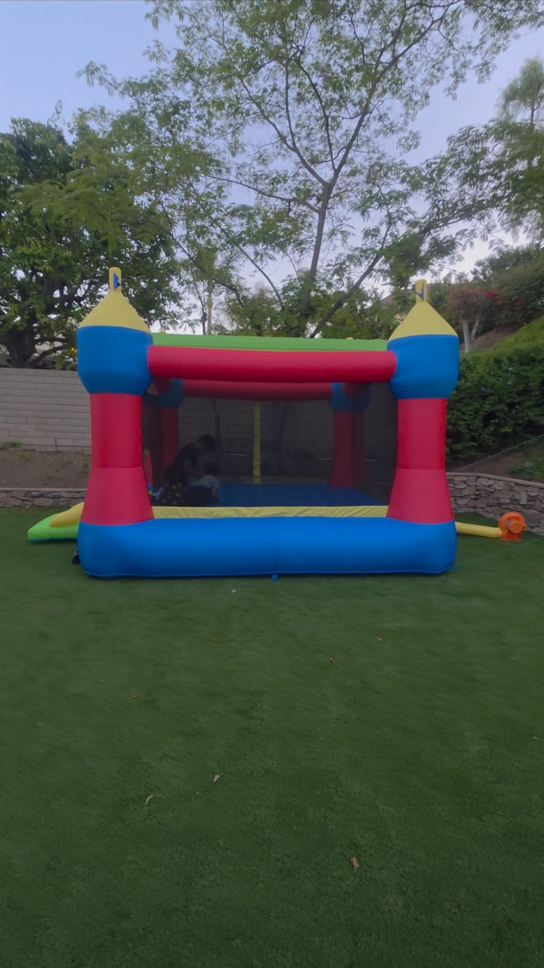 Bounceland Inflatable Party Castle Bounce House Bouncer, 16 ft L x 13 ft W x 10.3 ft H, Basketball Hoop, Removable Sun Roof, UL Strong Blower included, Fun Slide and Bounce Area, Castle Theme for Kids customer photo 1