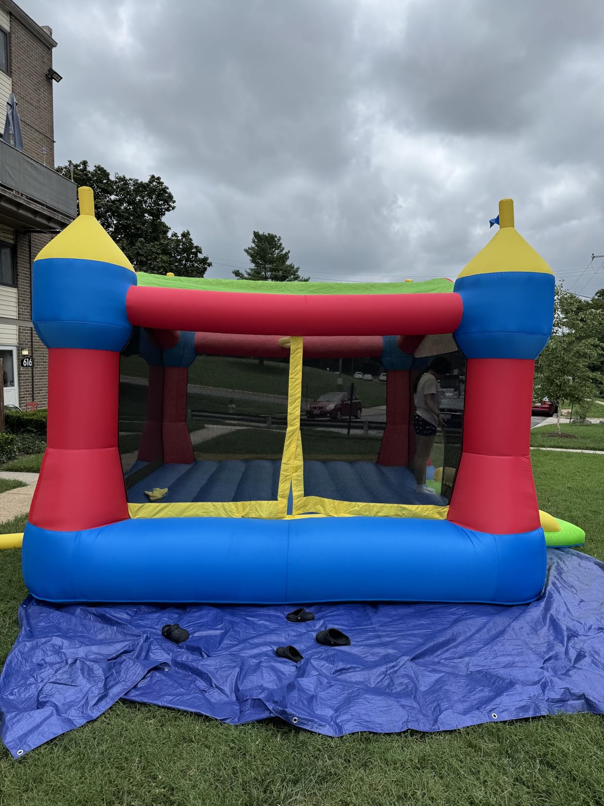 Bounceland Inflatable Party Castle Bounce House Bouncer, 16 ft L x 13 ft W x 10.3 ft H, Basketball Hoop, Removable Sun Roof, UL Strong Blower included, Fun Slide and Bounce Area, Castle Theme for Kids customer photo 2