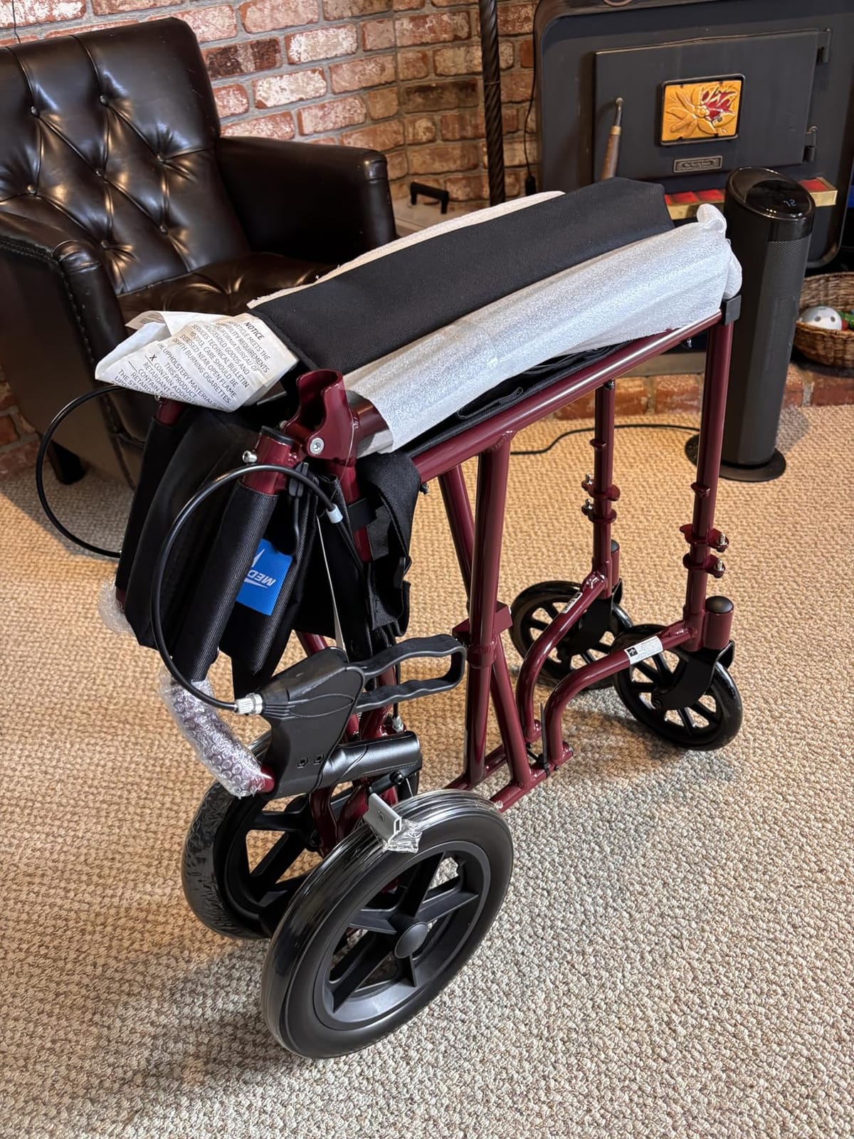 Medline Lightweight Foldable Transport Wheelchair with Handbrakes and 12-Inch Wheels, Red Frame, Black Upholstery customer photo 1