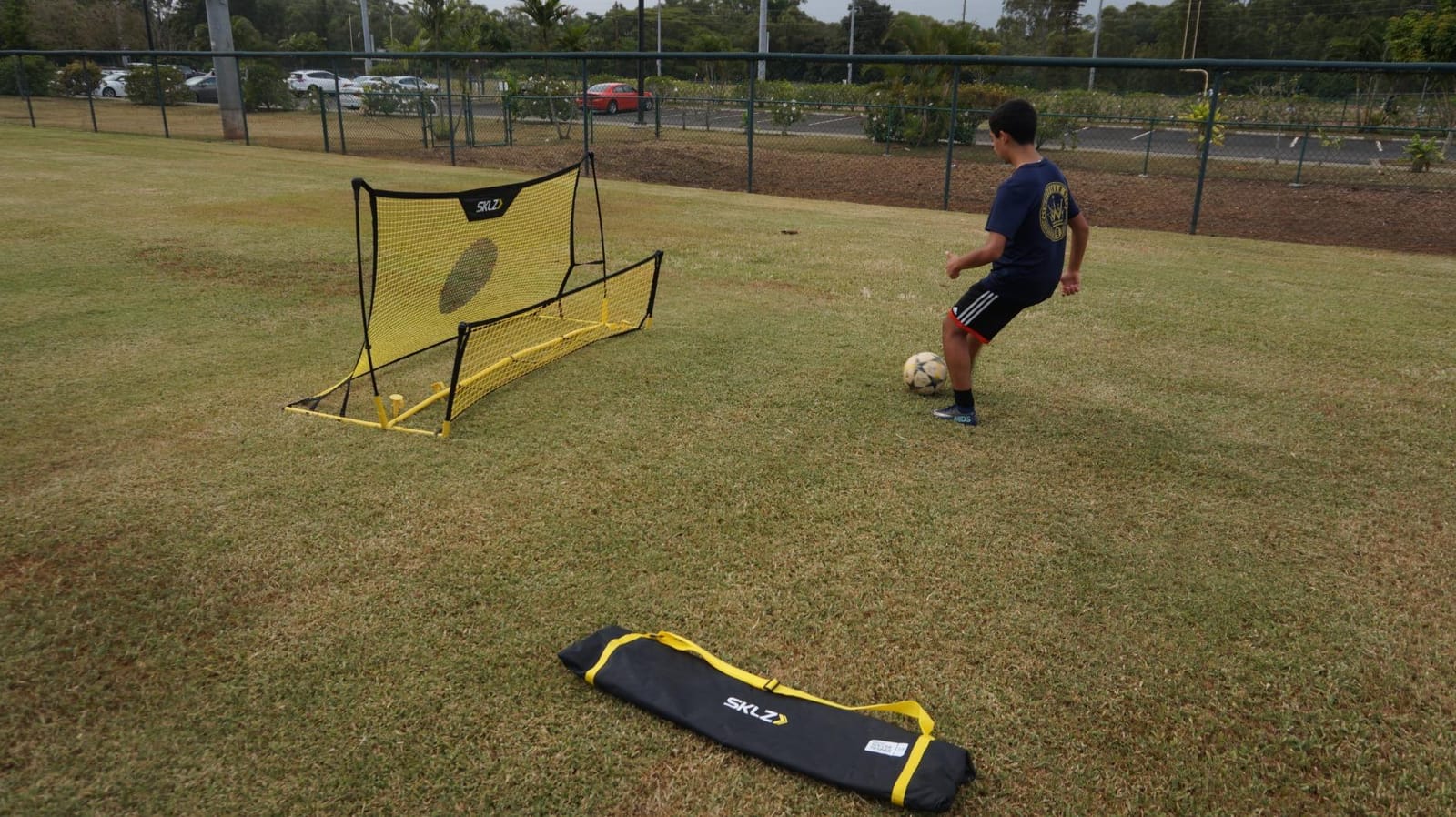 SKLZ Quickster Soccer Trainer - Dual-Sided Rebounder for Solo Passing, Receiving, Trapping Practice - Large & Small Rebound Net - Weather Resistant - Adjustable Frame, Metal Stakes & Carry Bag customer photo 1