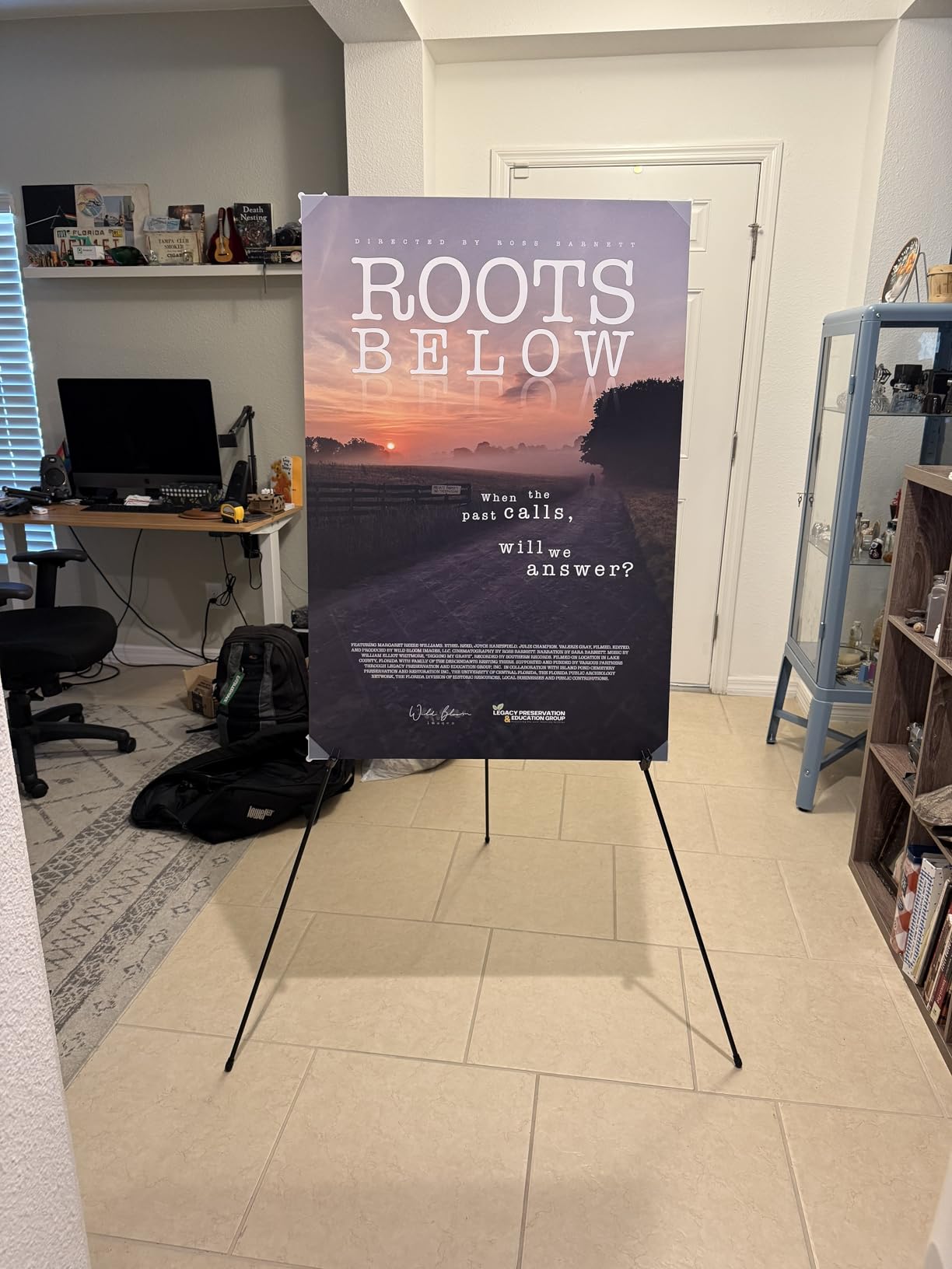 Amazon Basics Easel Display Stand, Instant Floor Poster, Lightweight, Collapsible and Portable with Tripod Base, Black Steel (supports 5 pounds) customer photo 1