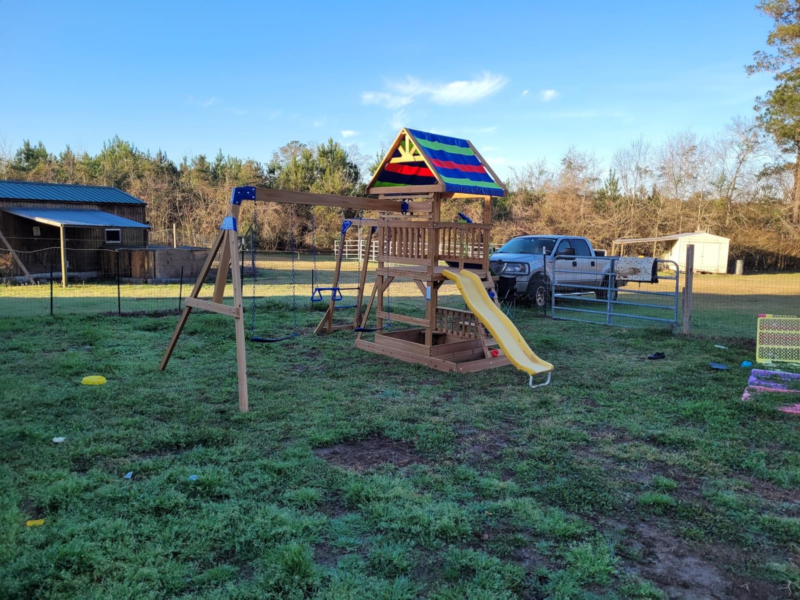 Backyard Discovery Beach Front Cedar Wood Swing Set with Wave Slide, Play Deck, Monkey Bars, Rock Wall Ladder, Shaded Picnic Area, Snack Bar, Belt Swings, Trapeze, Sandbox Area, Outdoor Playset customer photo 2