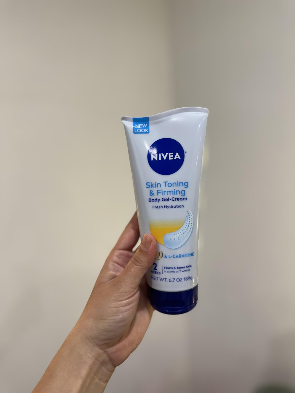 NIVEA Skin Firming & Toning Body Gel Cream with Q10, Hyaluronic Acid and Vitamin C, Clinically Tested Skin Firming & Toning Cream, 72-Hour Moisture, 6.7 Oz Tube customer photo 2