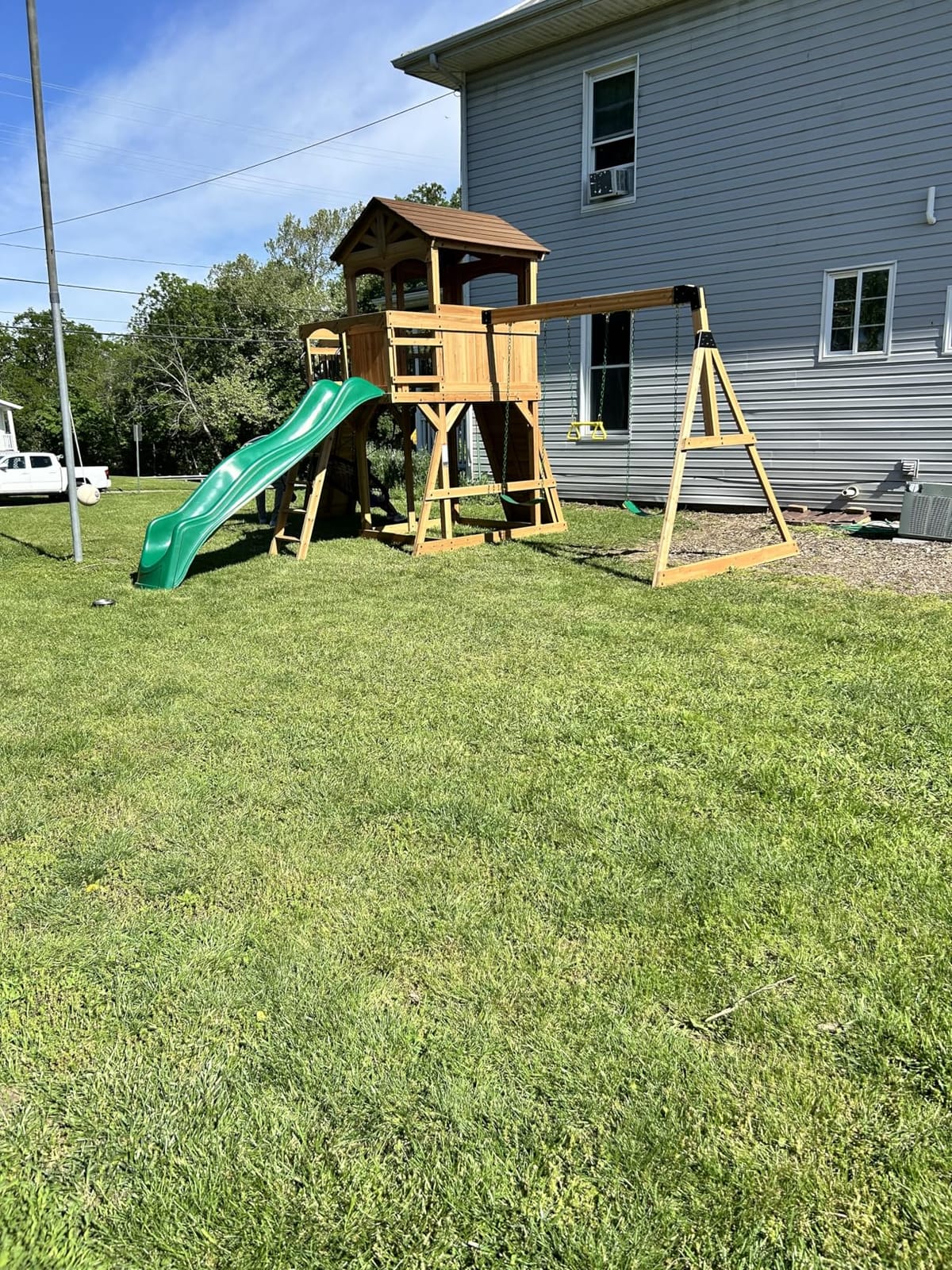 Backyard Discovery Dover Bay Spruce Wood Swing Set with Wave Slide, Clubhouse, Monkey Bars, Rock Wall, Belt Swings, Step Ladder, Toy Telescope, Chalkboard, Outdoor Playset customer photo 2
